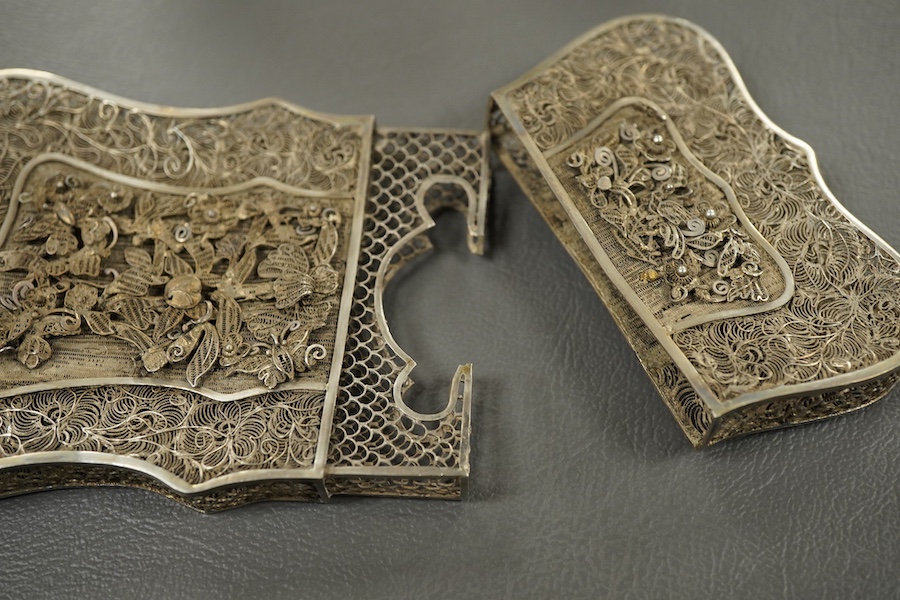 A modern silver pepperette, Birmingham, 1988, 14cm, a silver mustard pot and associated silver spoon, a silver mounted notecase and a filigree white metal card case.